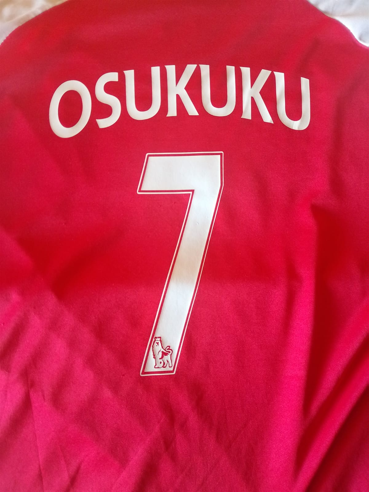 Custom football jersey with name and number print for individual client by Jumotas Technologies