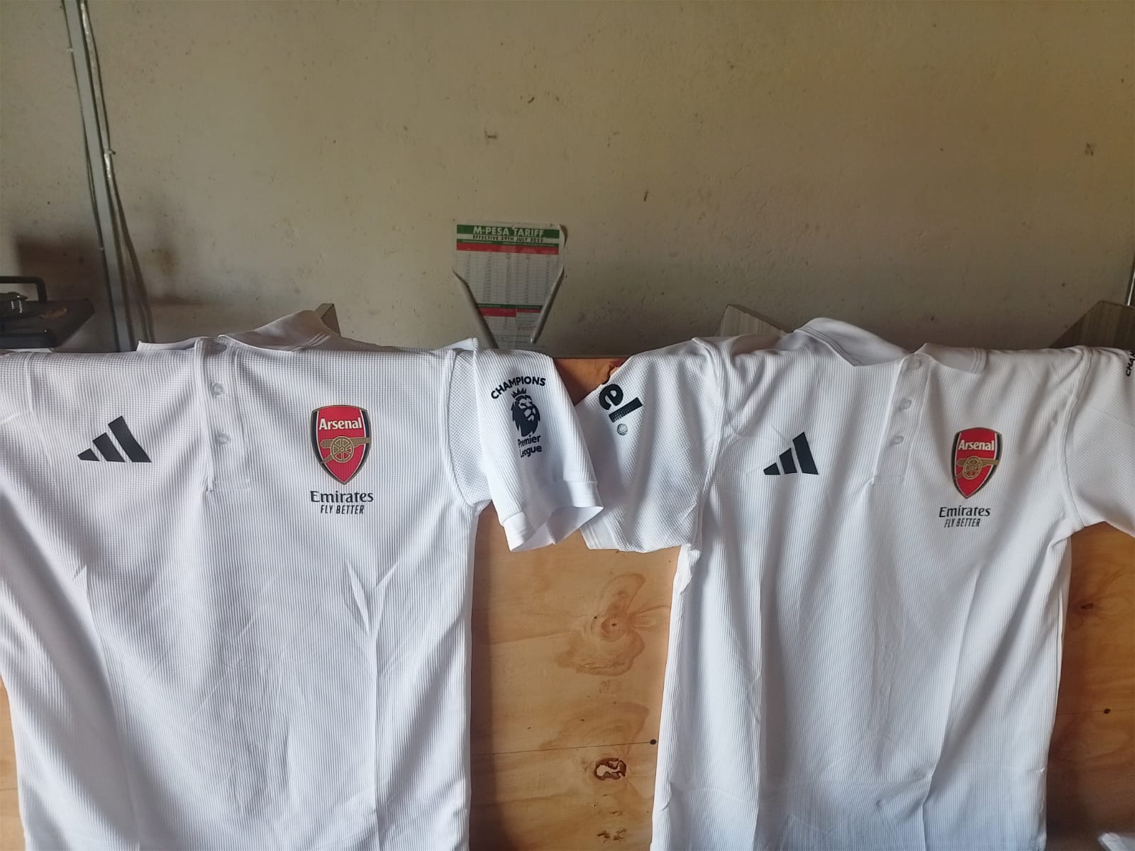 Batch of white polo shirts printed for Arsenal team by Jumotas Technologies